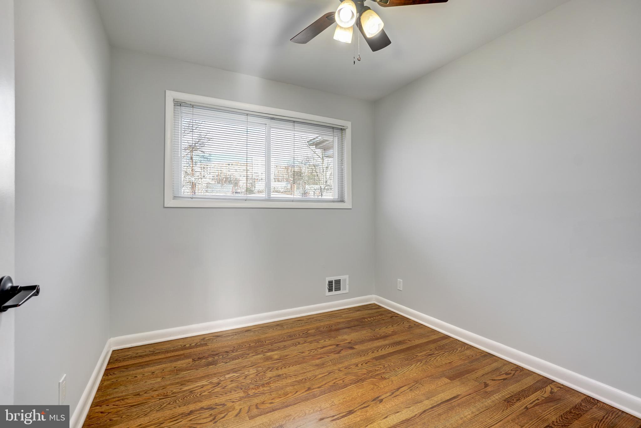 1446 Roxanna Road Northwest Washington, DC 20012 - Photo 16 of 34 wooden floor in an empty room