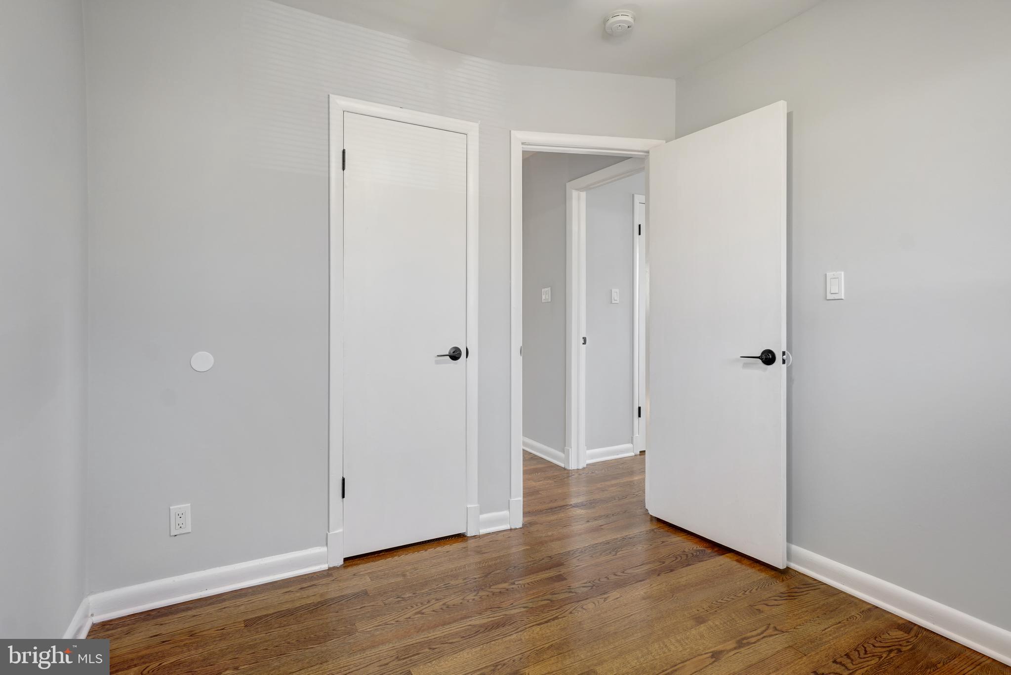 1446 Roxanna Road Northwest Washington, DC 20012 - Photo 17 of 34 a view of a room with wooden floor