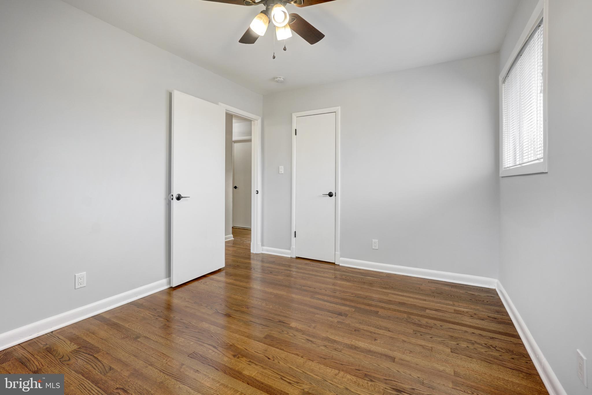 1446 Roxanna Road Northwest Washington, DC 20012 - Photo 19 of 34 a view of an empty room with wooden floor