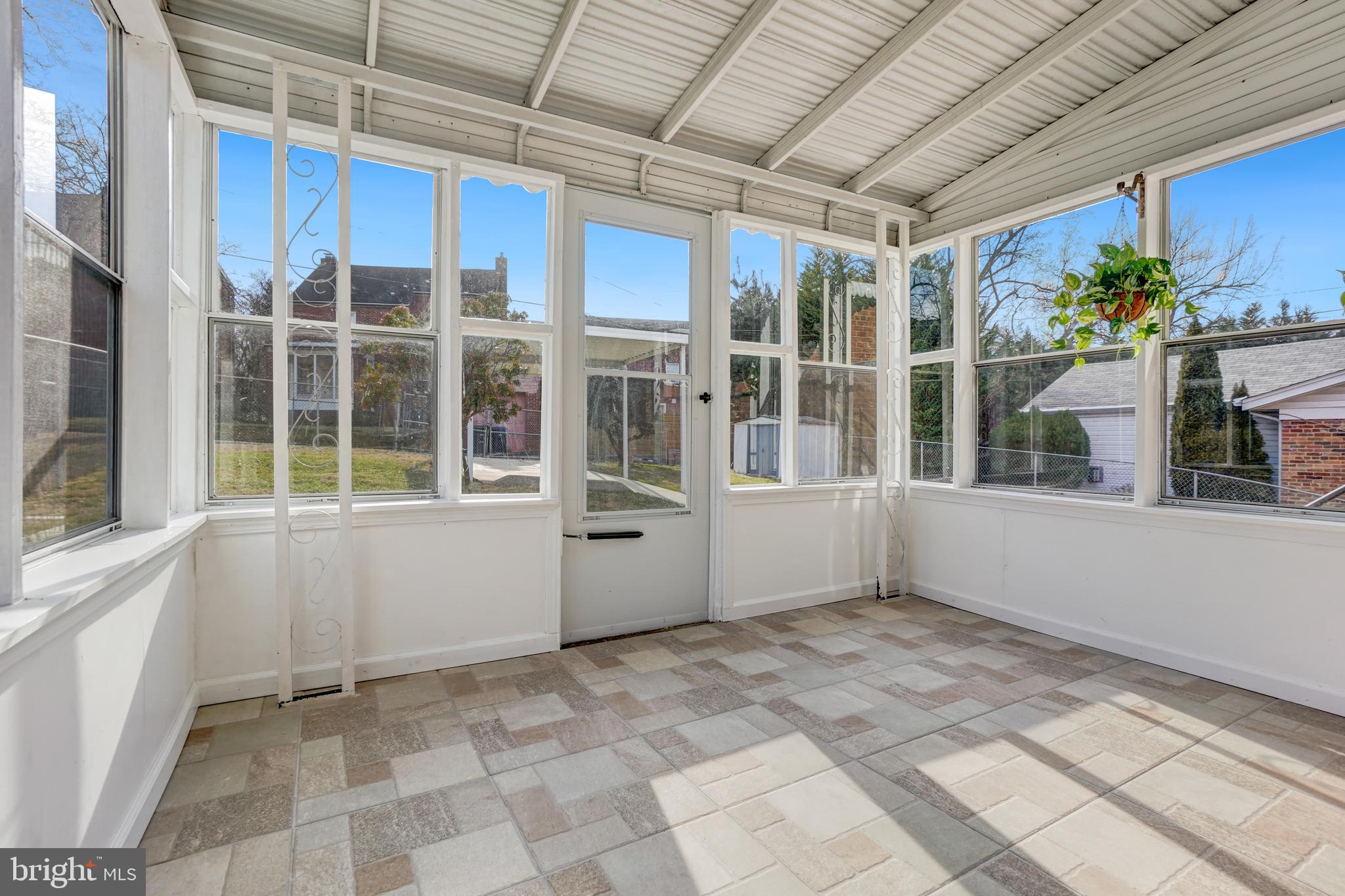 1446 Roxanna Road Northwest Washington, DC 20012 - Photo 30 of 34 a view of an empty room with a window