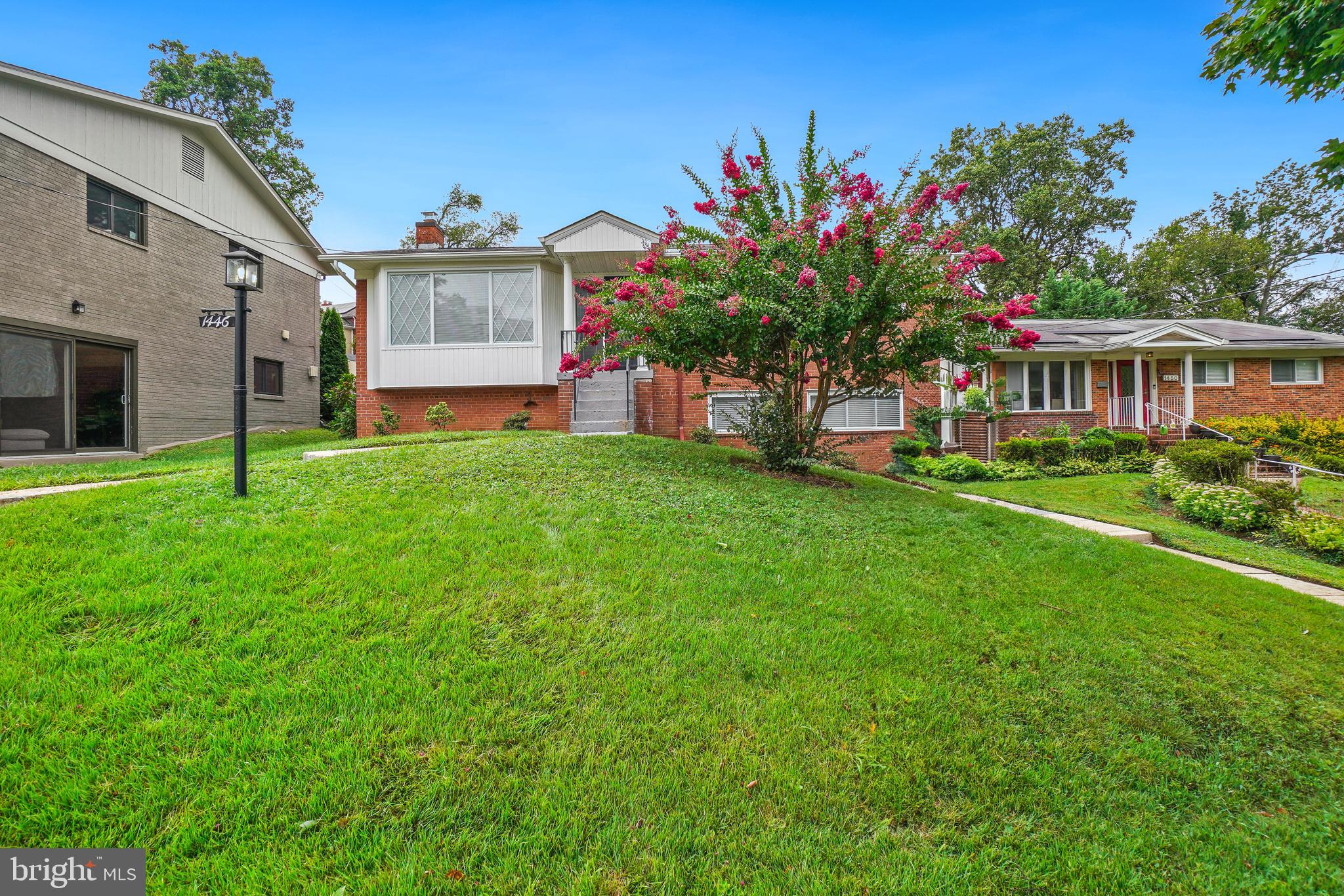 1446 Roxanna Road Northwest Washington, DC 20012 - Photo 3 of 34 a house that has a tree in front of it