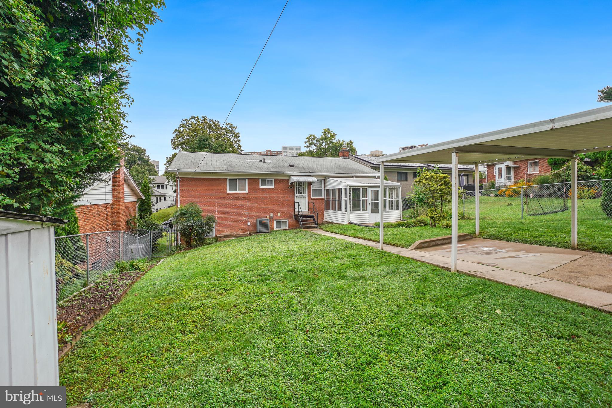 1446 Roxanna Road Northwest Washington, DC 20012 - Photo 31 of 34 a view of a house with backyard and porch