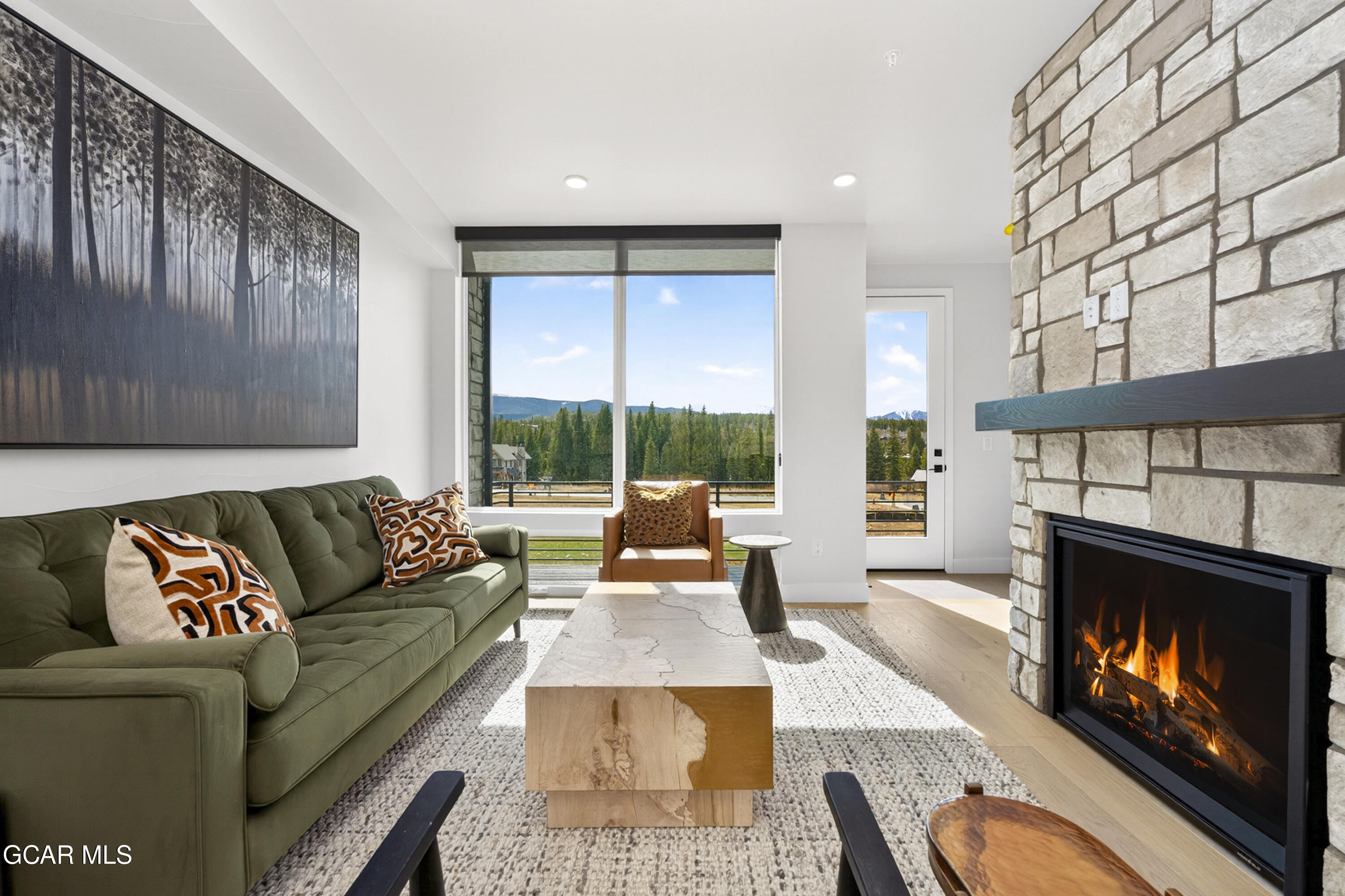 56 Wheeler Road Winter Park, CO 80482 - Photo 16 of 42 a living room with furniture fireplace and window
