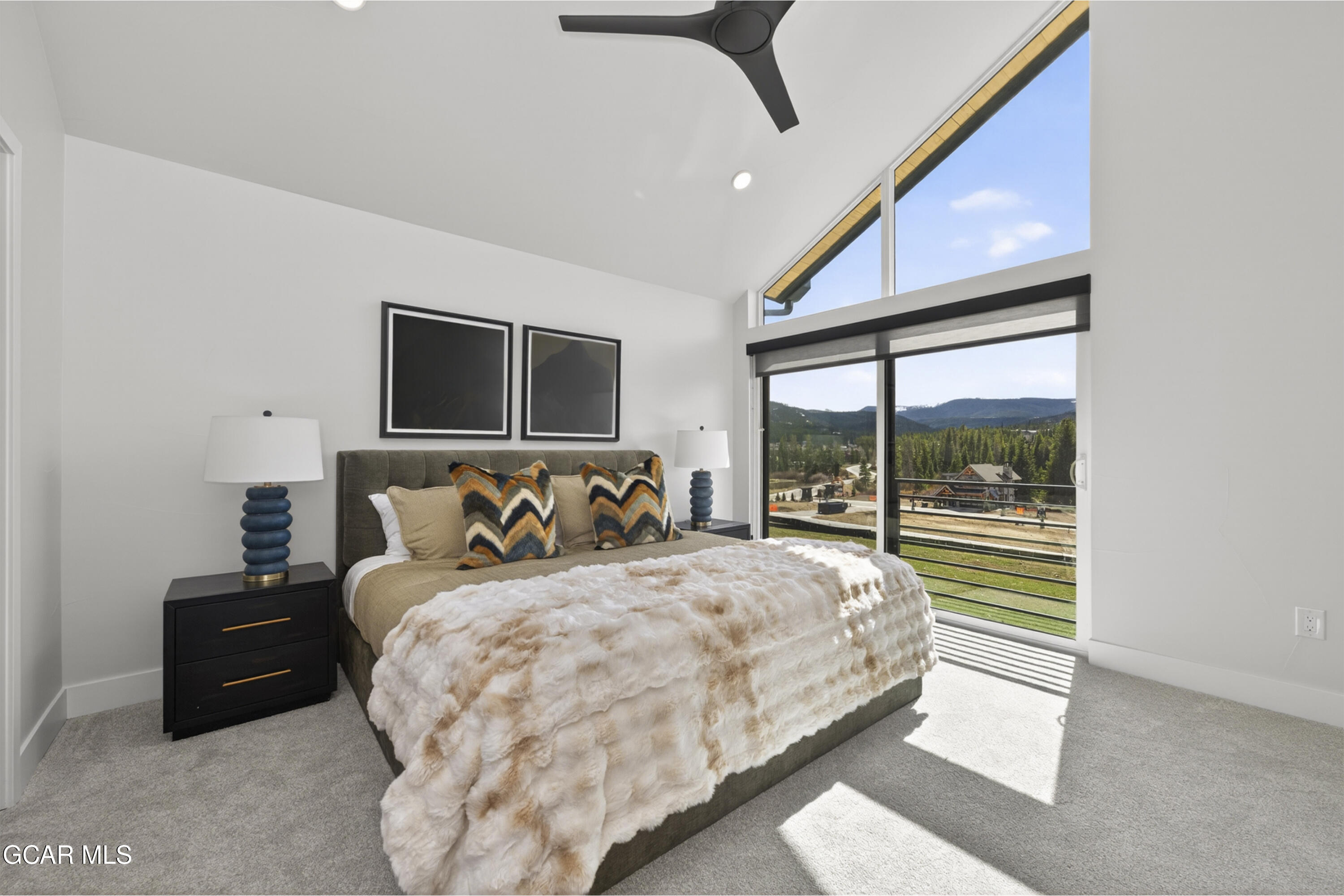 56 Wheeler Road Winter Park, CO 80482 - Photo 27 of 42 a bedroom with a bed and a large window