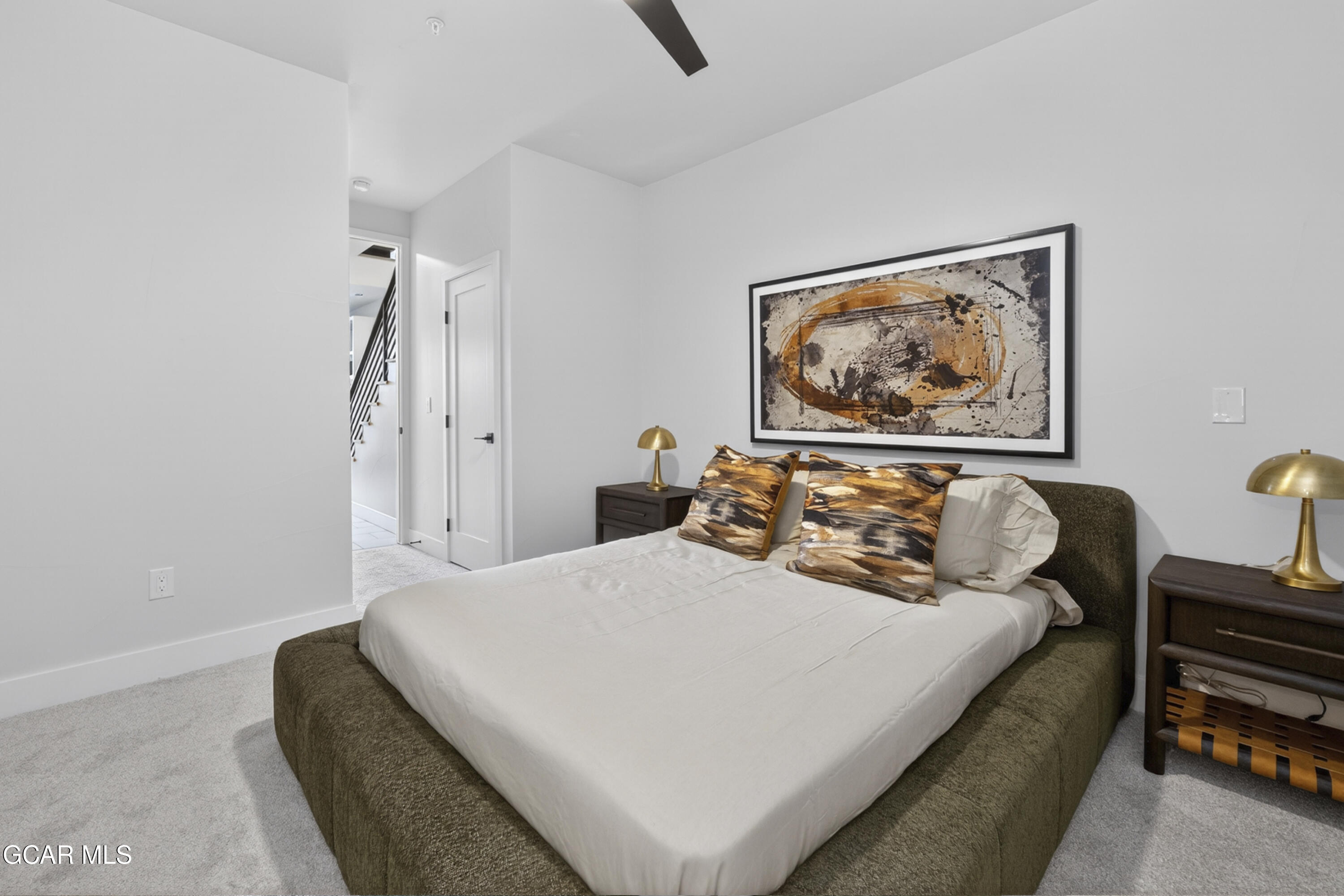 56 Wheeler Road Winter Park, CO 80482 - Photo 35 of 42 a bedroom with bed and a painting on the wall