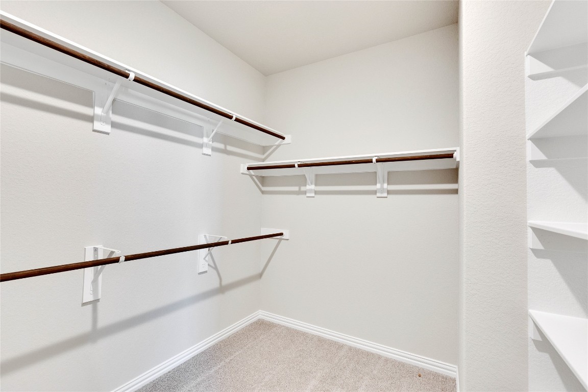 13709 Tucker Hedge Pass Elgin, TX 78621 - Photo 8 of 14 Spacious closet with light colored carpet