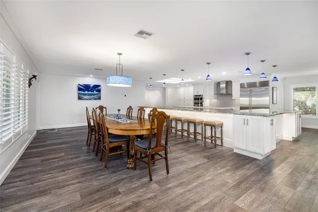 a kitchen with a sink stove and refrigerator