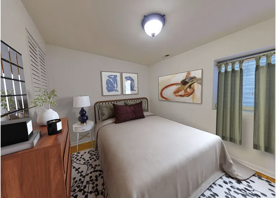 426 Ridge Road, Unit 426 Wilmette, IL 60091 - Photo 2 of 5 a bedroom with bed and wooden floor