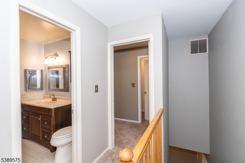32 Sam Bonnell Drive Clinton, NJ 08809 - Photo 16 of 30 a view of bathroom with a toilet sink and mirror