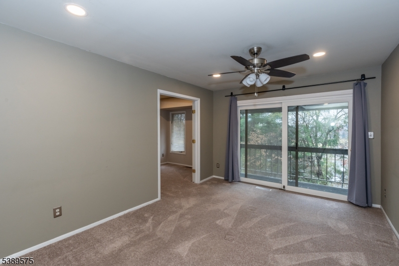 32 Sam Bonnell Drive Clinton, NJ 08809 - Photo 18 of 30 a view of a livingroom with a ceiling fan and window