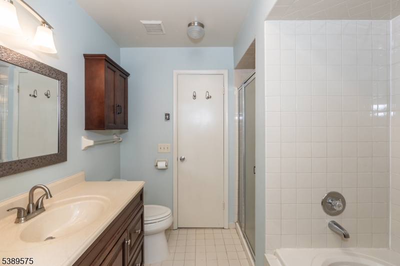 32 Sam Bonnell Drive Clinton, NJ 08809 - Photo 23 of 30 a bathroom with a sink a toilet and shower