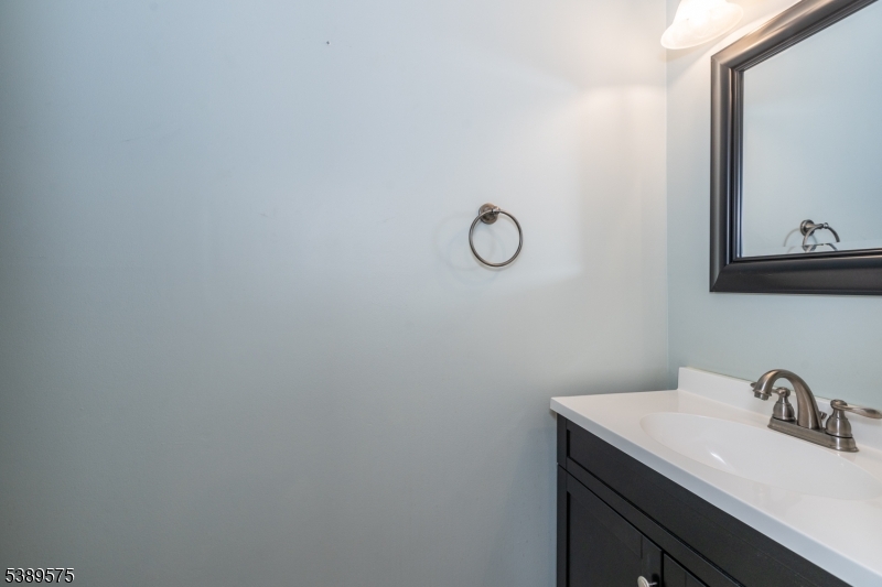 32 Sam Bonnell Drive Clinton, NJ 08809 - Photo 25 of 30 a bathroom with a sink and a mirror