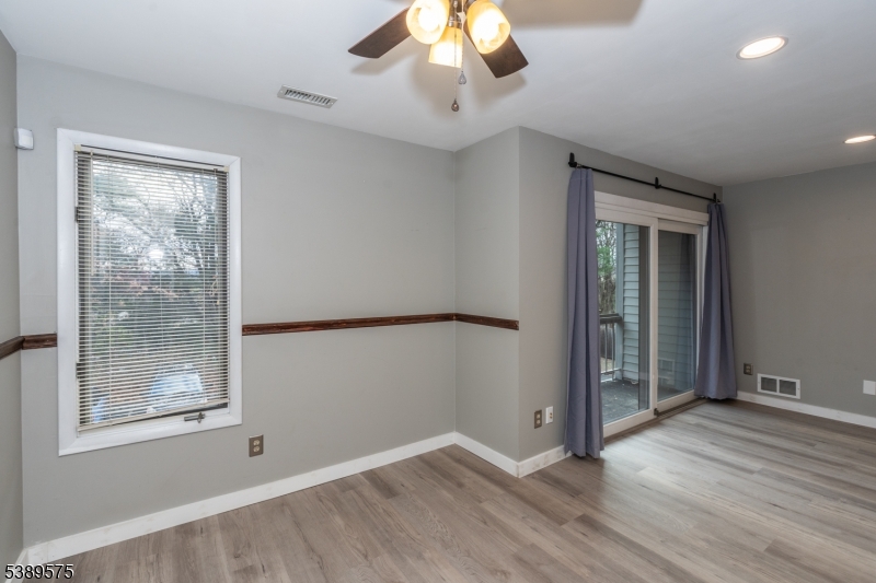 32 Sam Bonnell Drive Clinton, NJ 08809 - Photo 8 of 30 a view of an empty room with wooden floor and a window