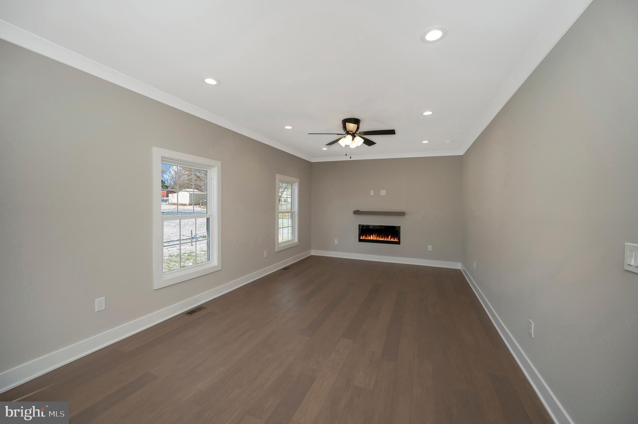 22 Rock Hill Church Road Stafford, VA 22556 - Photo 24 of 54 Family room with ceiling fan and electric fireplac