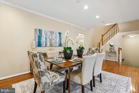 a kitchen with kitchen island granite countertop a sink window and cabinets