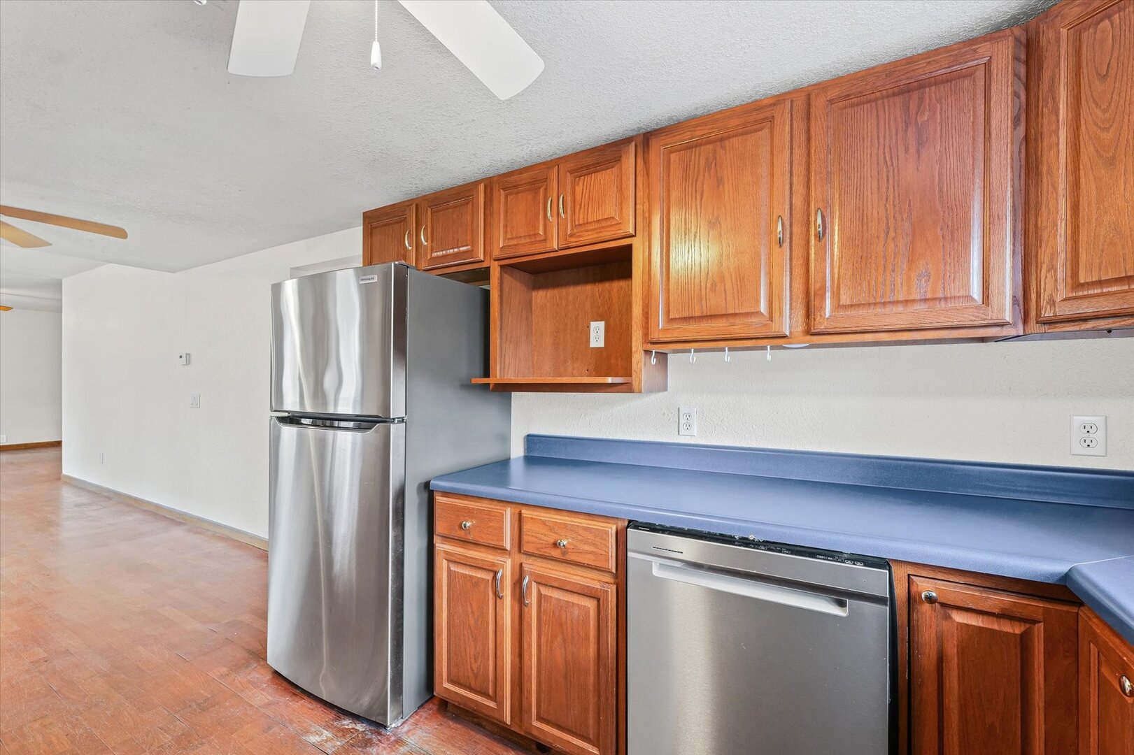 501 East McClelland Street Monticello, IL 61856 - Photo 12 of 31 a kitchen with stainless steel appliances granite countertop a refrigerator and cabinets