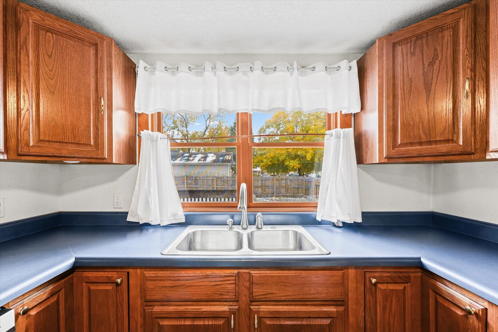 501 East McClelland Street Monticello, IL 61856 - Photo 13 of 31 a kitchen with granite countertop a sink and a window