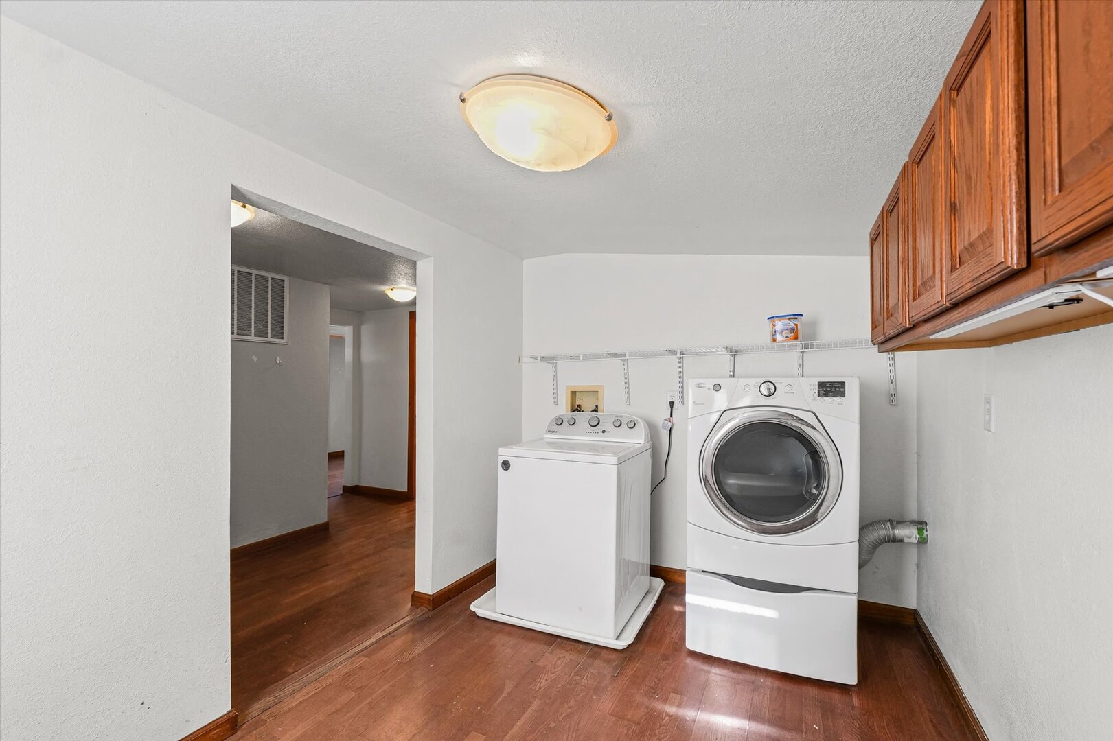 501 East McClelland Street Monticello, IL 61856 - Photo 21 of 31 a view of a kitchen with wooden floor and washing machine
