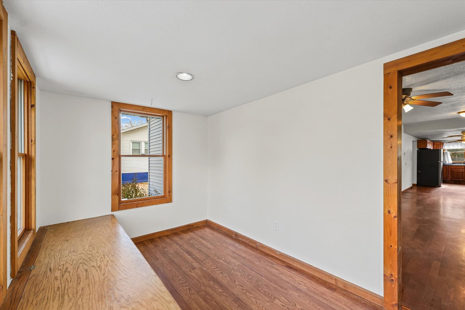 501 East McClelland Street Monticello, IL 61856 - Photo 5 of 31 a view of a room with wooden floor and windows
