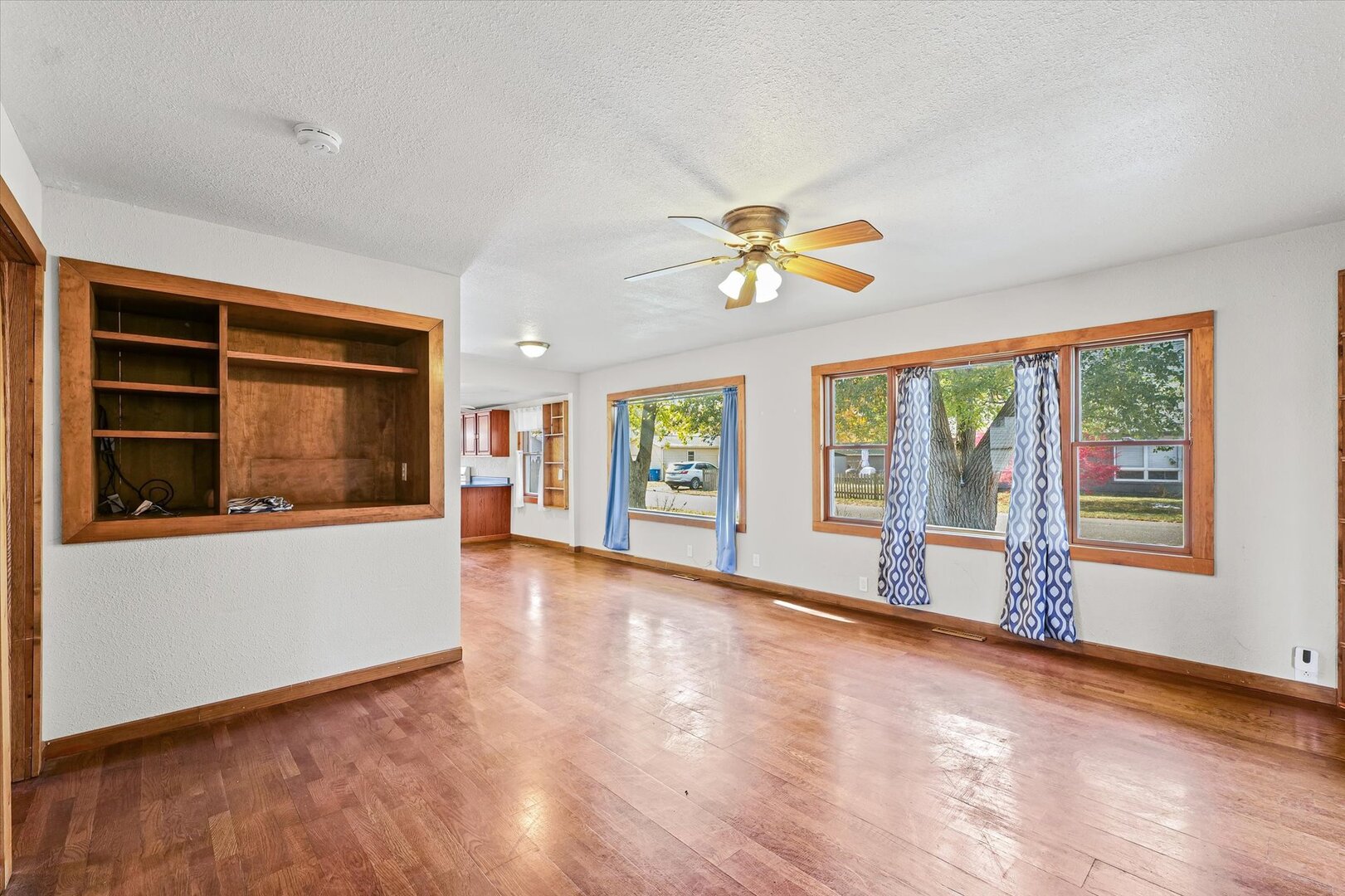 501 East McClelland Street Monticello, IL 61856 - Photo 8 of 31 a view of an empty room with a window and wooden floor