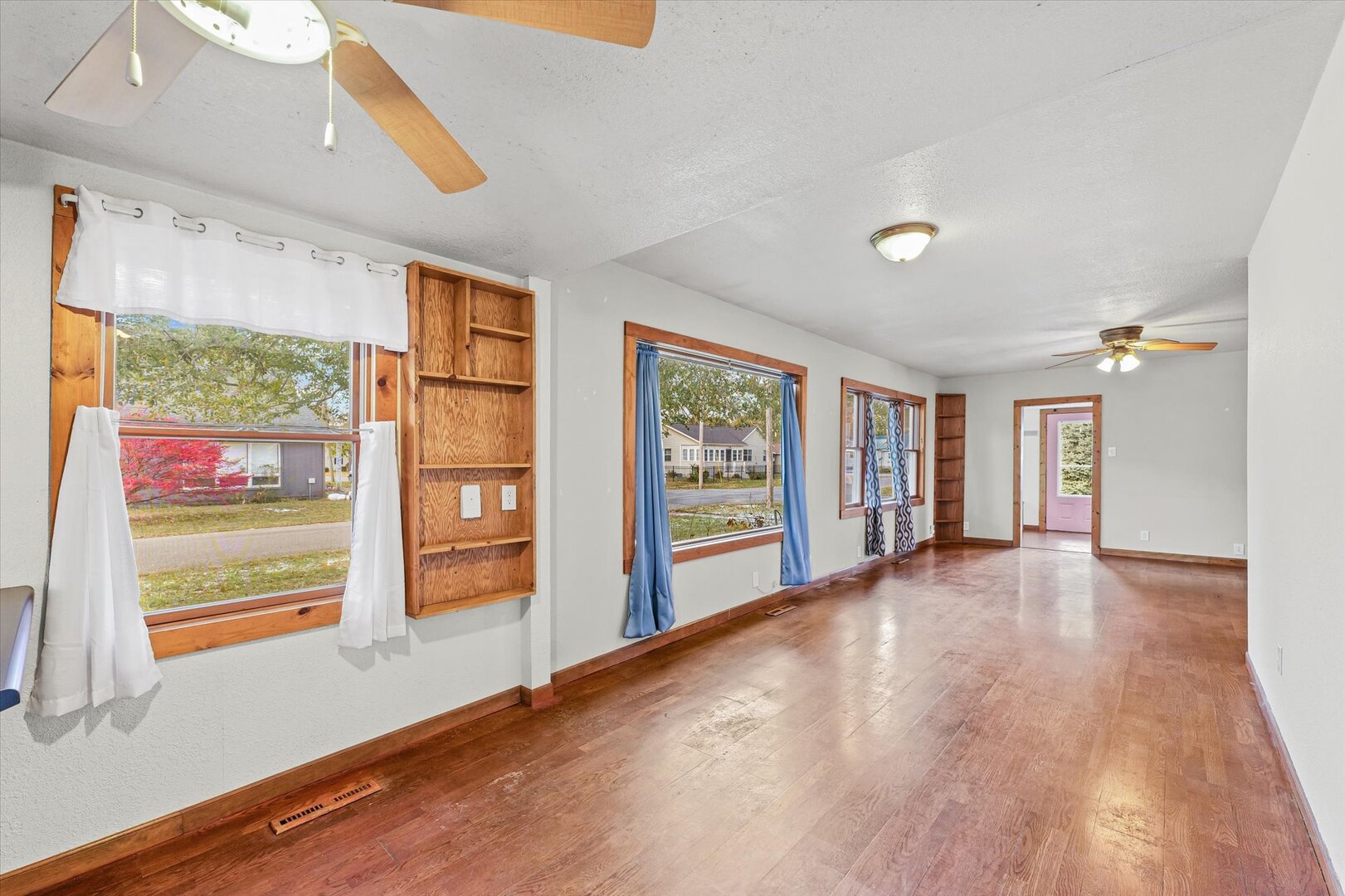 501 East McClelland Street Monticello, IL 61856 - Photo 10 of 31 a view of an empty room with a window and wooden floor