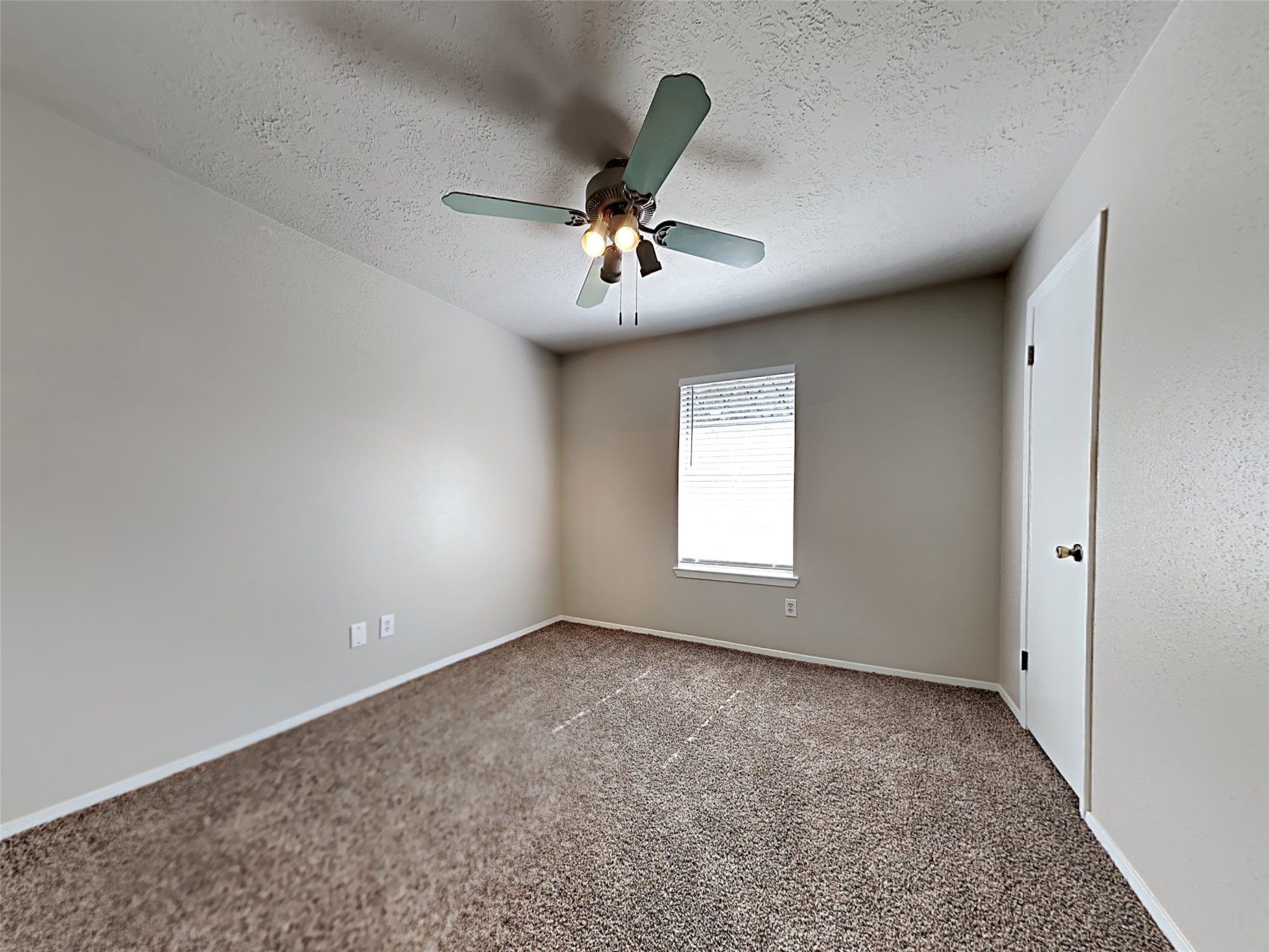 14919 Wainsfield Lane Channelview, TX 77530 - Photo 8 of 17 a view of room with a ceiling fan and window