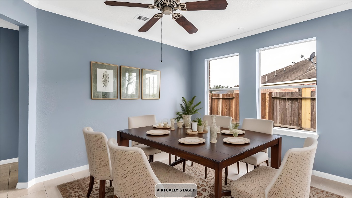 5534 Calm Court Houston, TX 77084 - Photo 14 of 48 a view of a dining room with furniture window and wooden floor