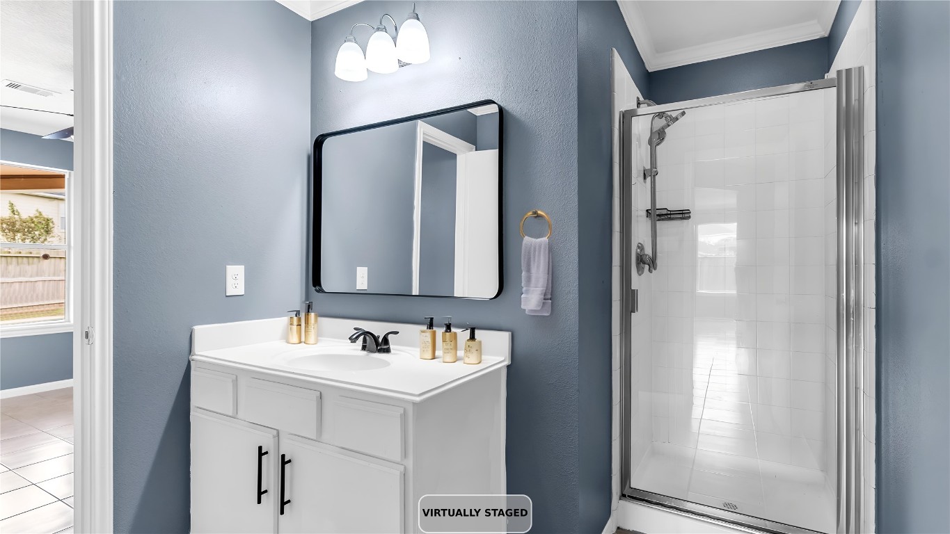 5534 Calm Court Houston, TX 77084 - Photo 18 of 48 a bathroom with a sink vanity and mirror