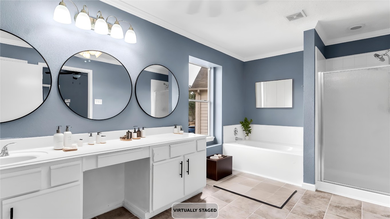 5534 Calm Court Houston, TX 77084 - Photo 22 of 48 a bathroom with a double vanity sink mirror and bathtub
