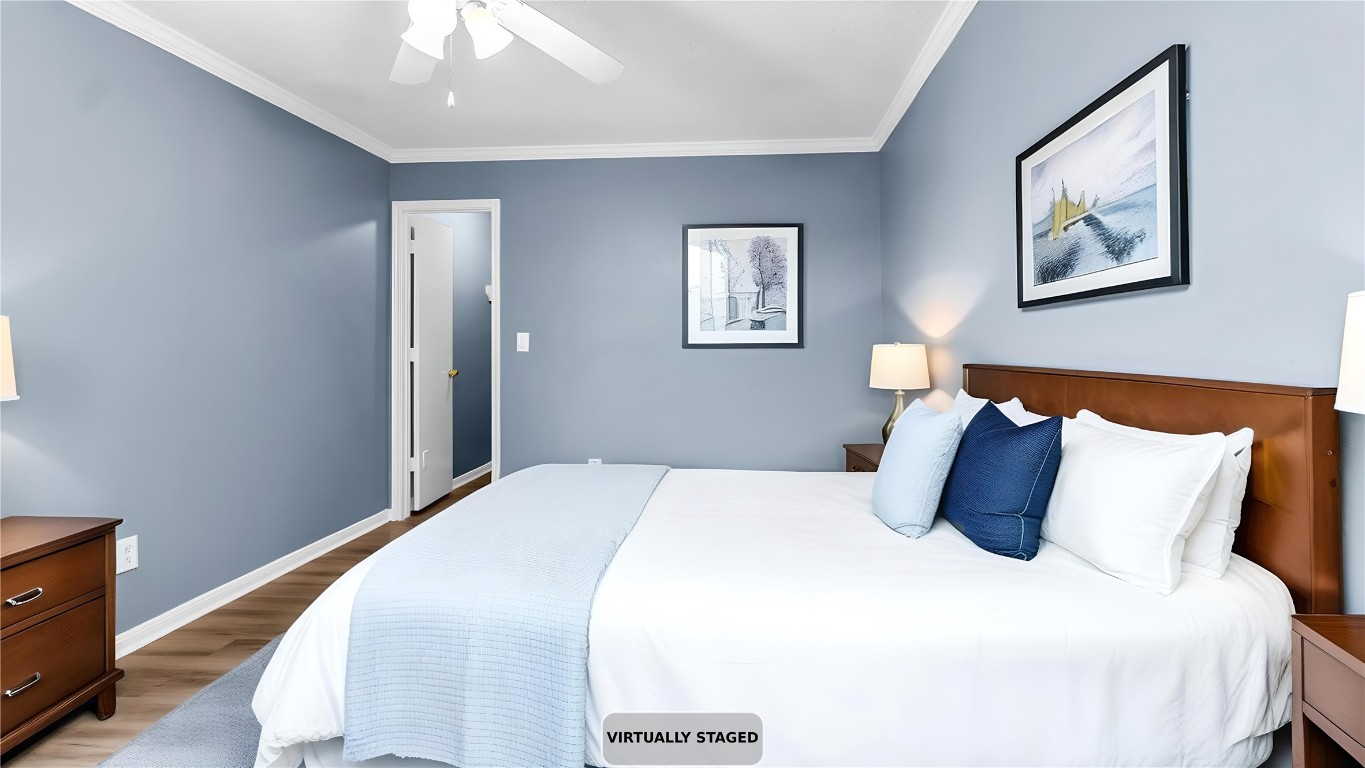 5534 Calm Court Houston, TX 77084 - Photo 26 of 48 a bedroom with a bed and painting on the wall