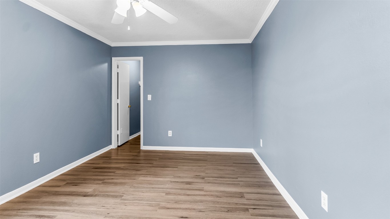 5534 Calm Court Houston, TX 77084 - Photo 27 of 48 a view of an empty room with wooden floor