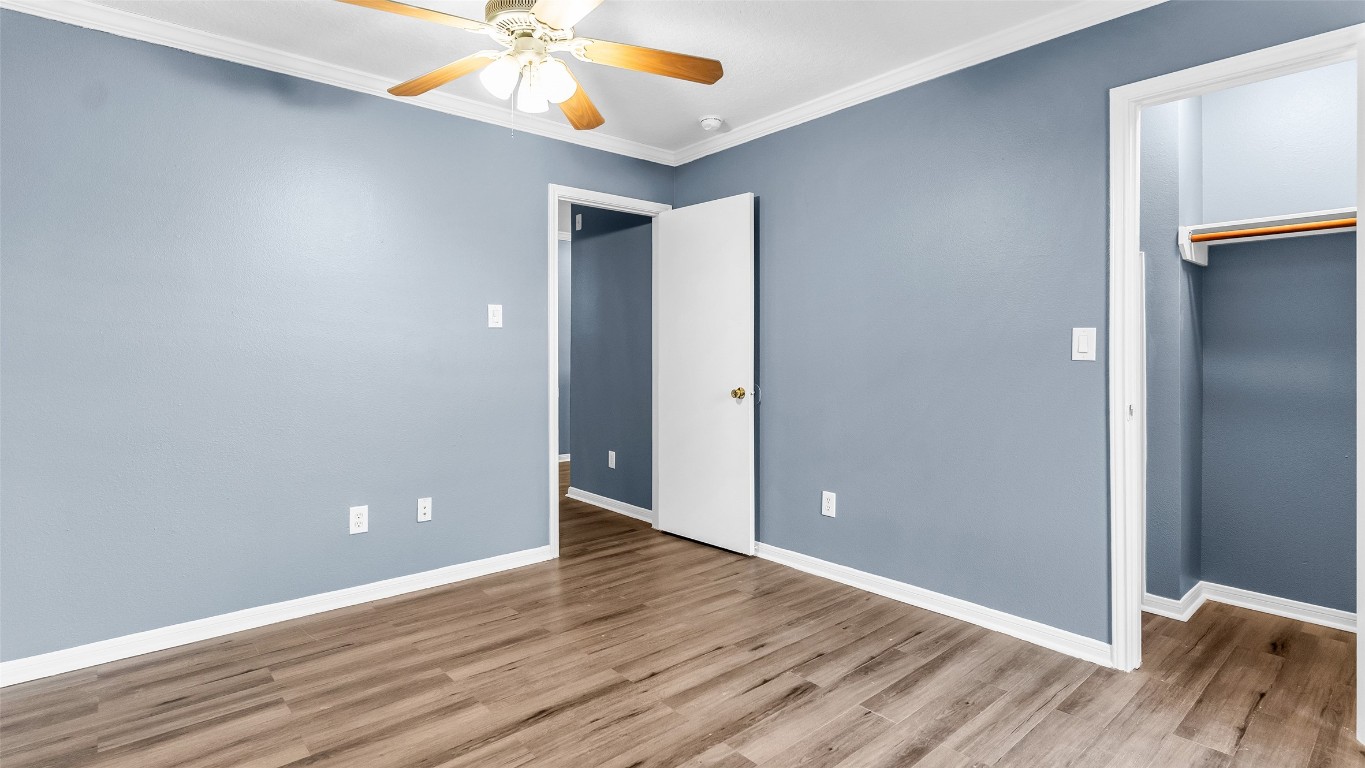 5534 Calm Court Houston, TX 77084 - Photo 31 of 48 wooden floor in an empty room with a window
