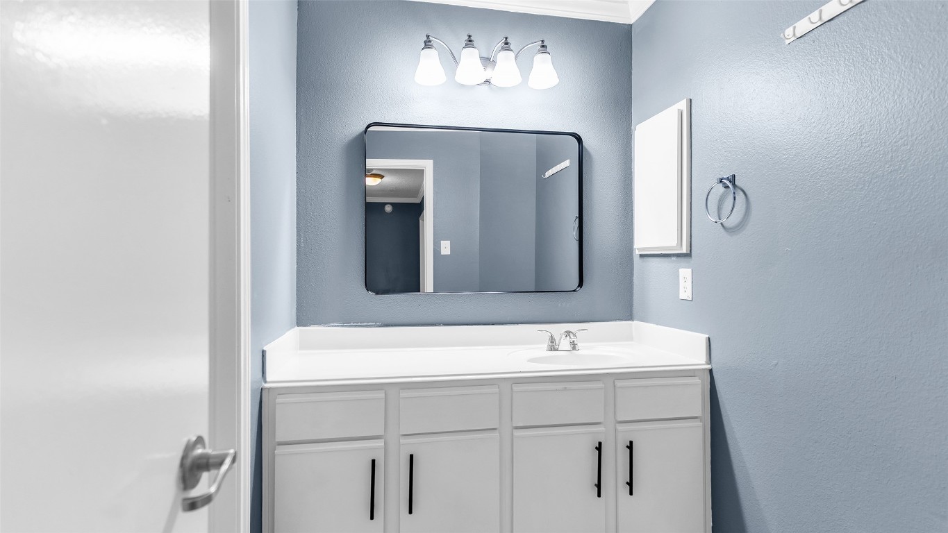 5534 Calm Court Houston, TX 77084 - Photo 33 of 48 a bathroom with a sink and a mirror