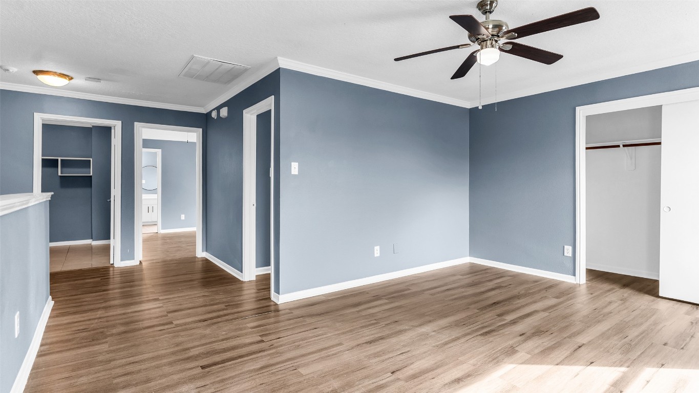 5534 Calm Court Houston, TX 77084 - Photo 36 of 48 a view of empty room with wooden floor