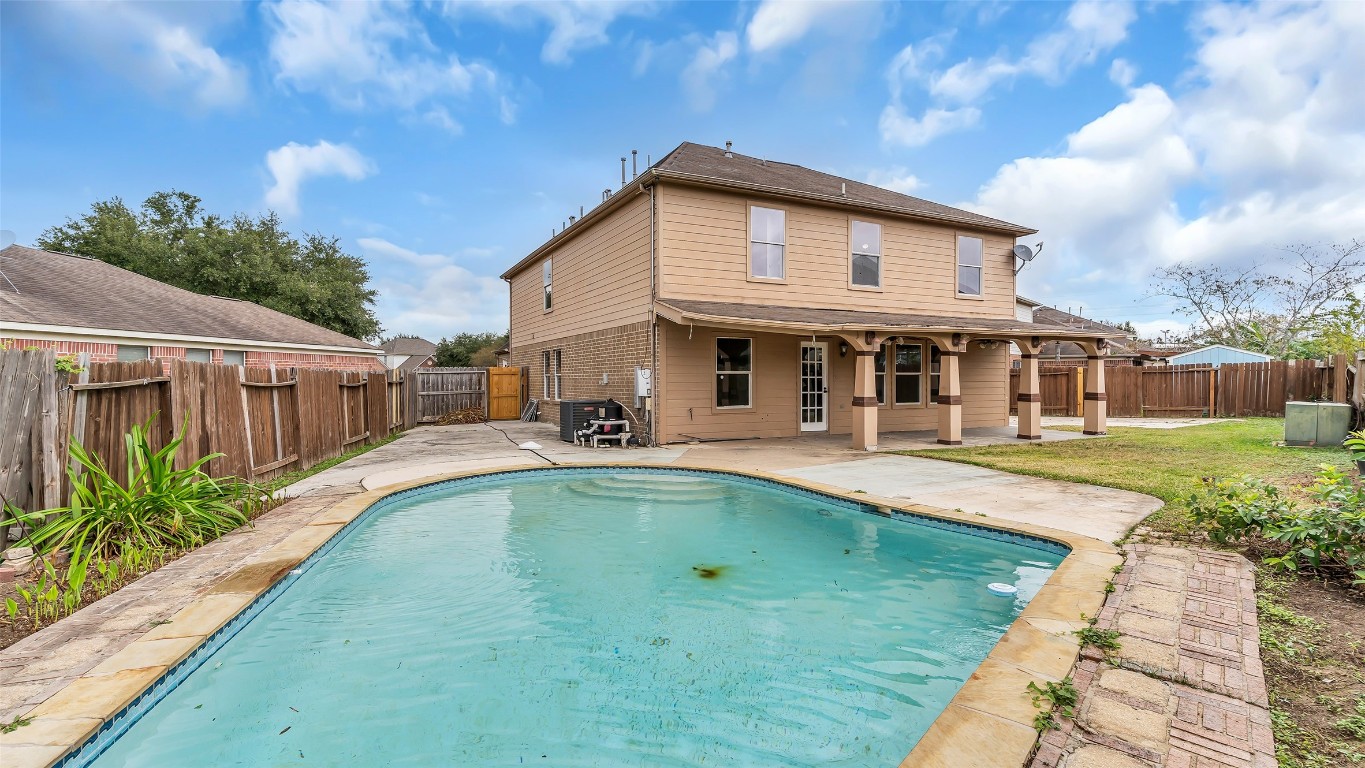 5534 Calm Court Houston, TX 77084 - Photo 39 of 48 a view of house with swimming pool and outdoor seating