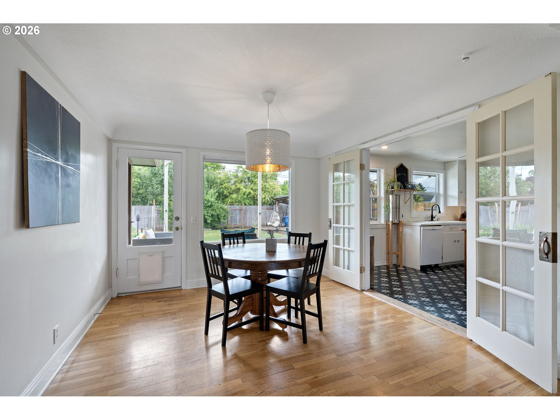 765 Louis Street Eugene, OR 97402 - Photo 11 of 45 a dining room with furniture and wooden floor