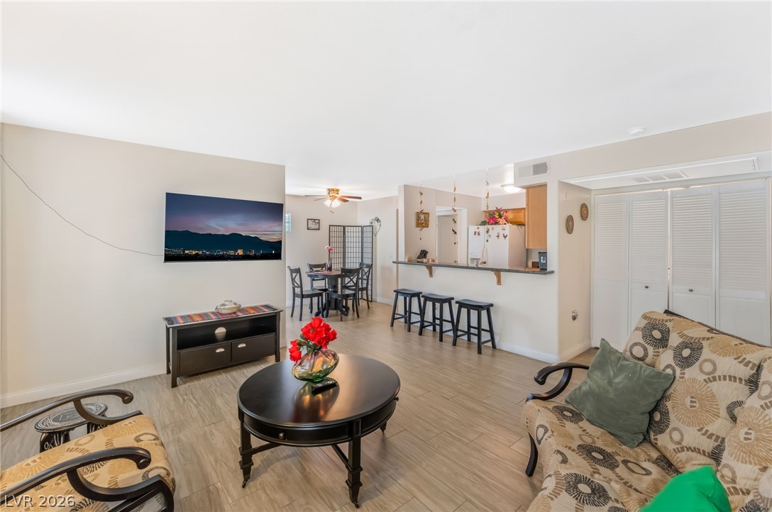 3145 East Flamingo Road, Unit 1092 Las Vegas, NV 89121 - Photo 33 of 33 Step into a sun-filled living area featuring an open floorplan and durable tile flooring.