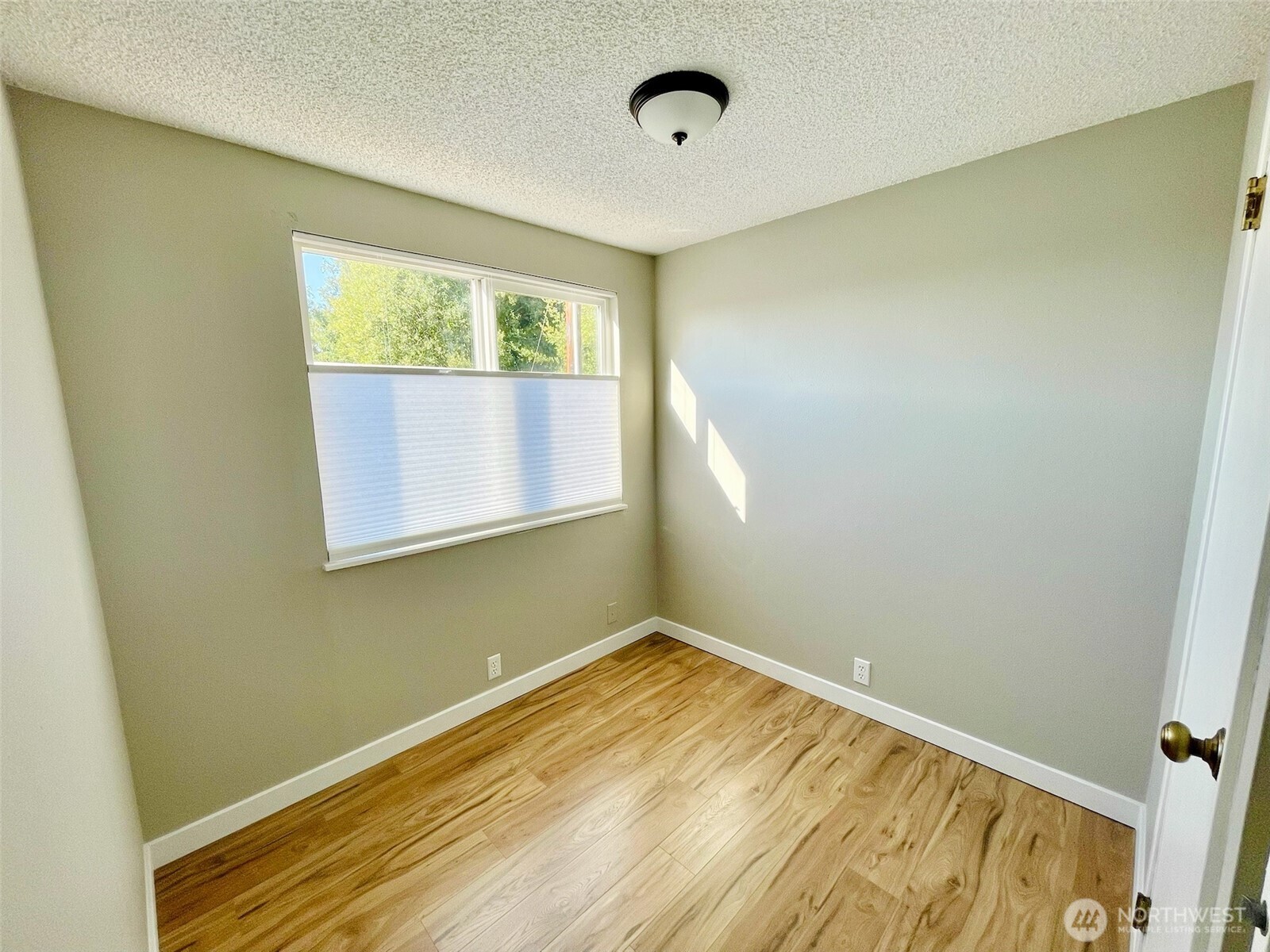 545 Hendricks Street, Unit 13 Port Townsend, WA 98368 - Photo 15 of 22 a view of a room with wooden floor and a window