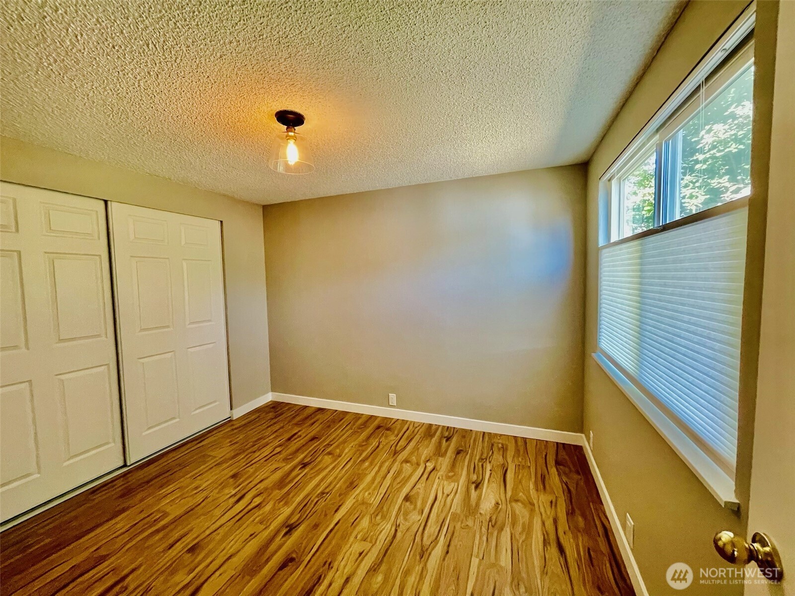 545 Hendricks Street, Unit 13 Port Townsend, WA 98368 - Photo 20 of 22 a view of a room with wooden floor