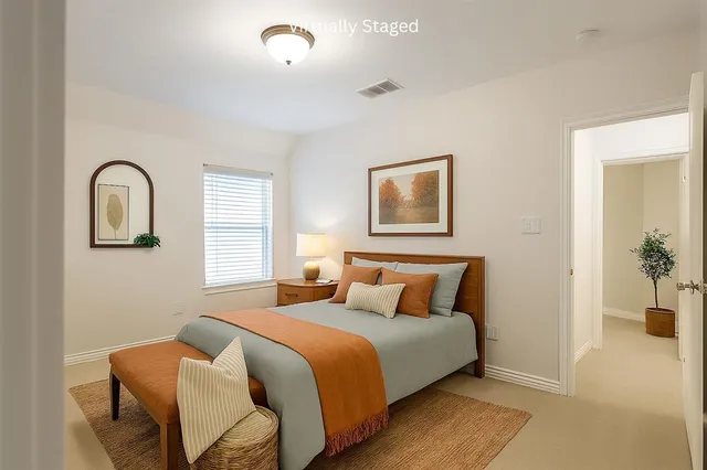 an empty room with a window and a ceiling fan