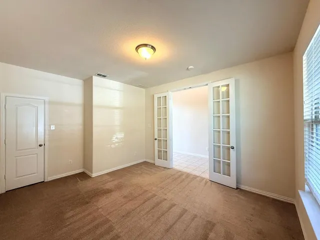 an empty room with a natural light