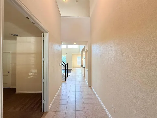 a view of a hallway with a wooden floor