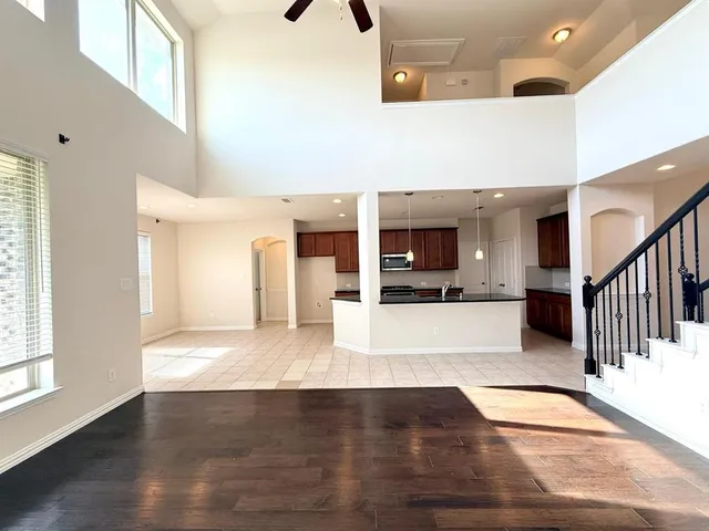 a view of an entryway with wooden floor