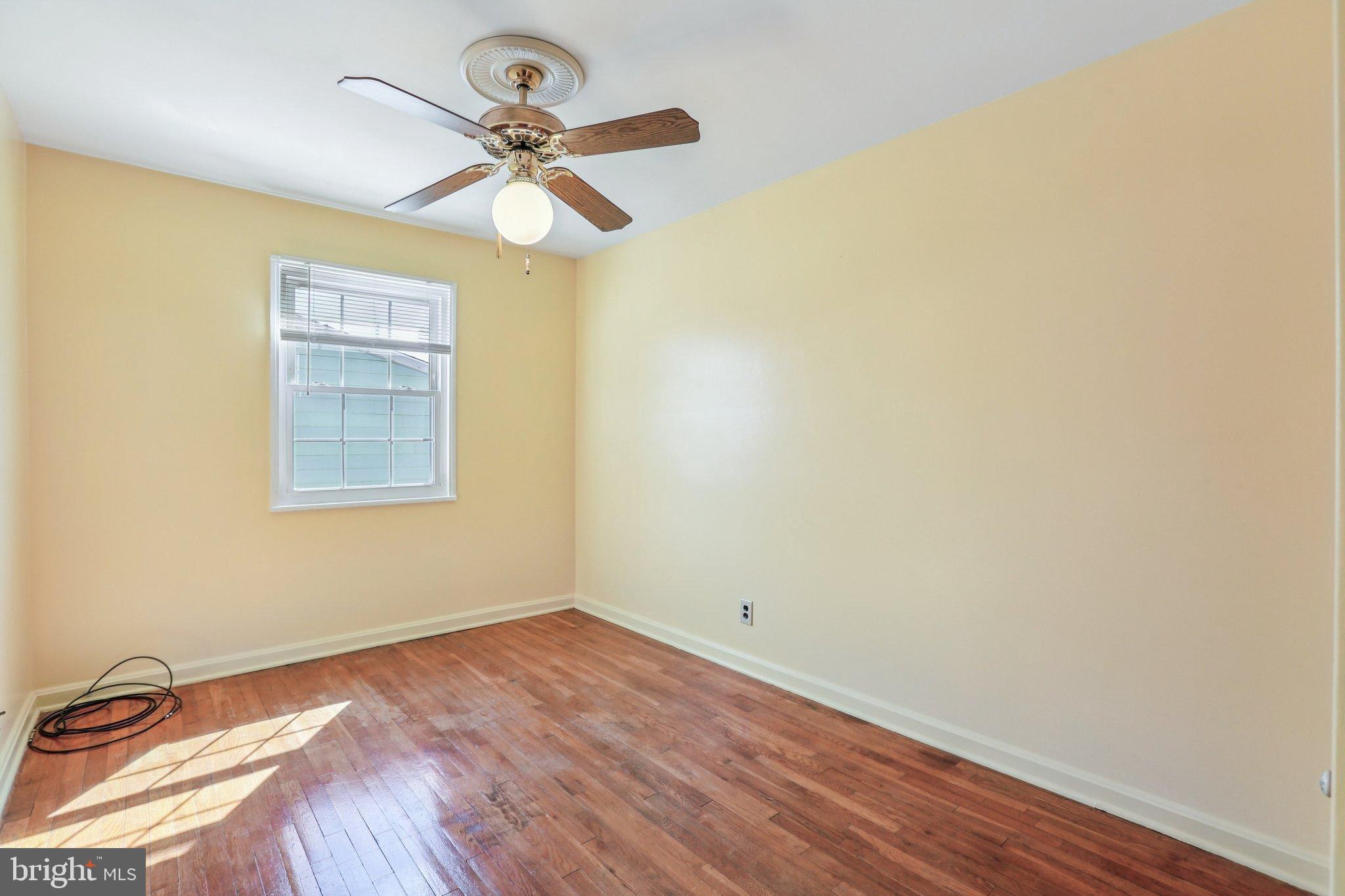 810 Lynvue Road Linthicum Heights, MD 21090 - Photo 13 of 45 Bright and airy room with hardwood floors.