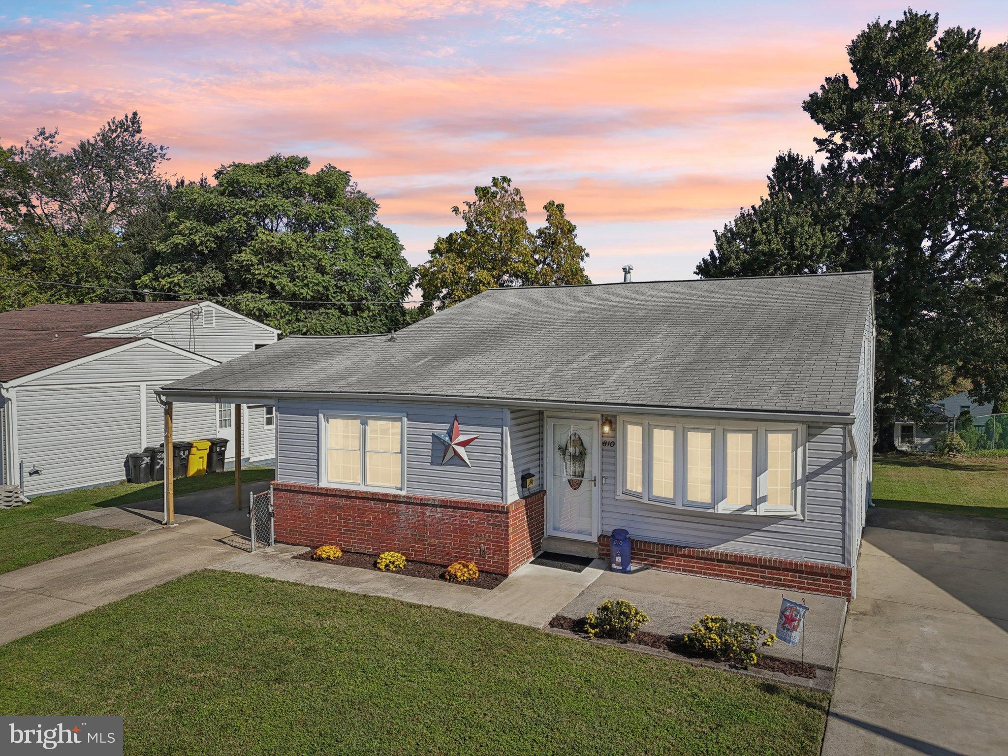 810 Lynvue Road Linthicum Heights, MD 21090 - Photo 3 of 45 Charming home with vibrant sunset backdrop.