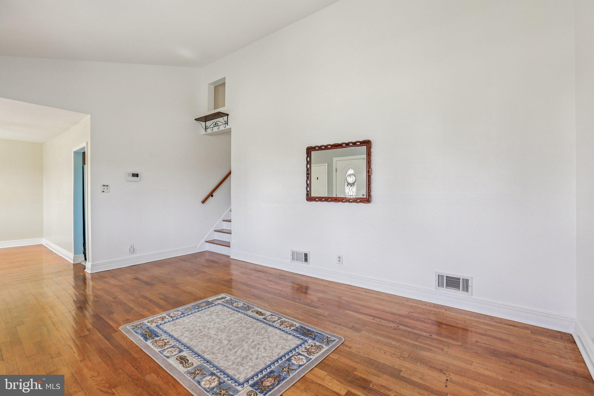 810 Lynvue Road Linthicum Heights, MD 21090 - Photo 6 of 45 Spacious room with warm wooden floors.