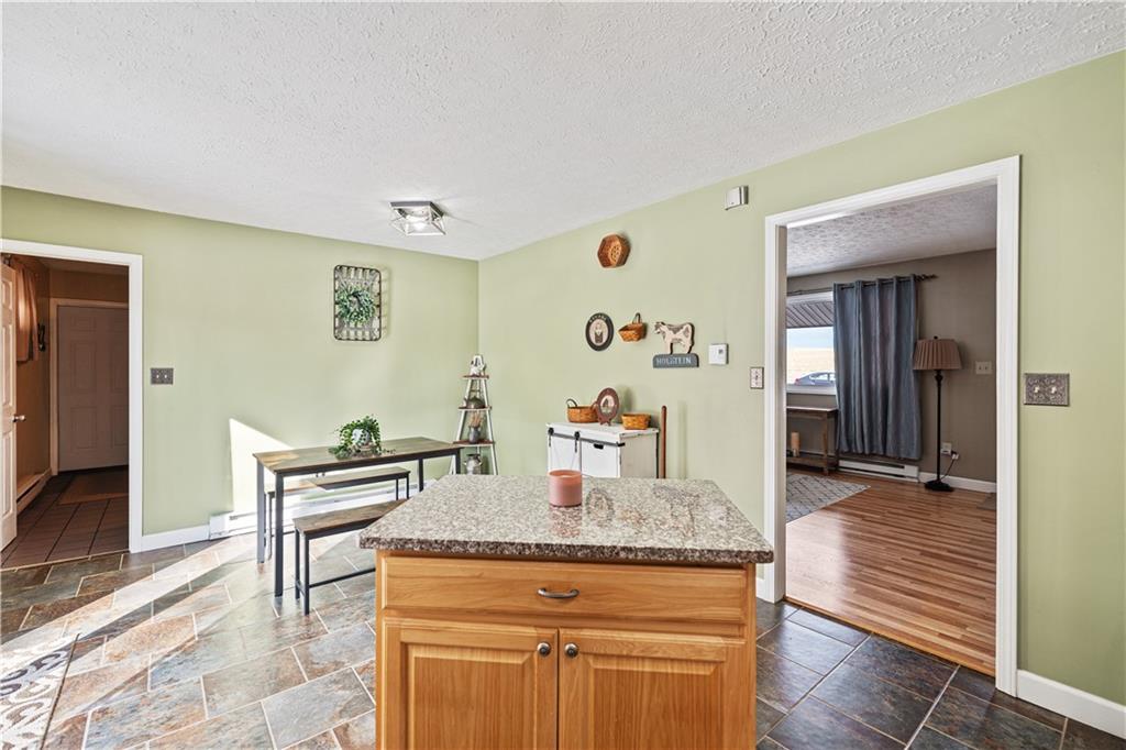 261 Casselman Road Markleton, PA 15551 - Photo 19 of 42 a view of kitchen island with furniture and wooden floor