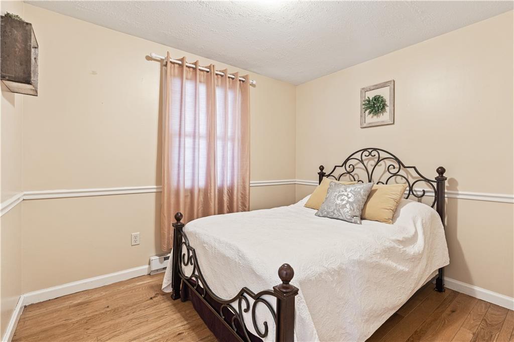 261 Casselman Road Markleton, PA 15551 - Photo 29 of 42 a bedroom with a bed and a dresser