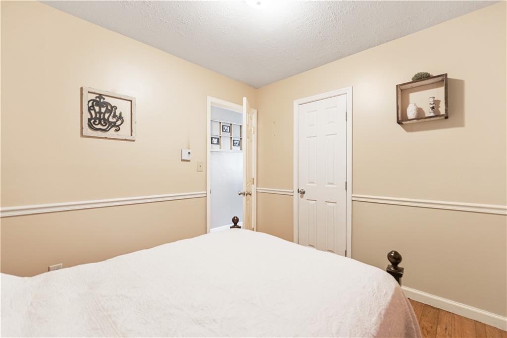 261 Casselman Road Markleton, PA 15551 - Photo 30 of 42 a bedroom with a bed and a view of bathroom