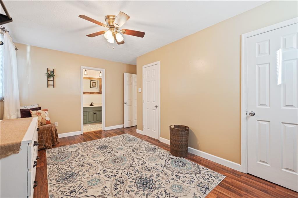 261 Casselman Road Markleton, PA 15551 - Photo 32 of 42 a bedroom with a bed and a chandelier